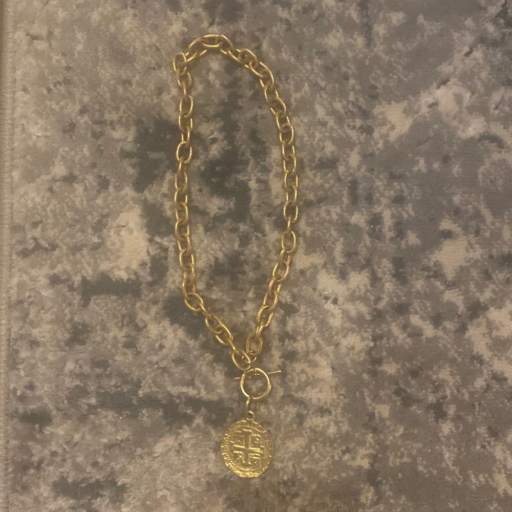 Gold necklace with toggle closure